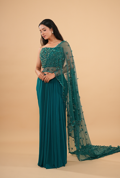 THE HAND-BEADED TEAL DRAPED SAREE WITH NET CAPE